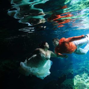 trash the dress in cenotes riviera maya underwater wedding photography