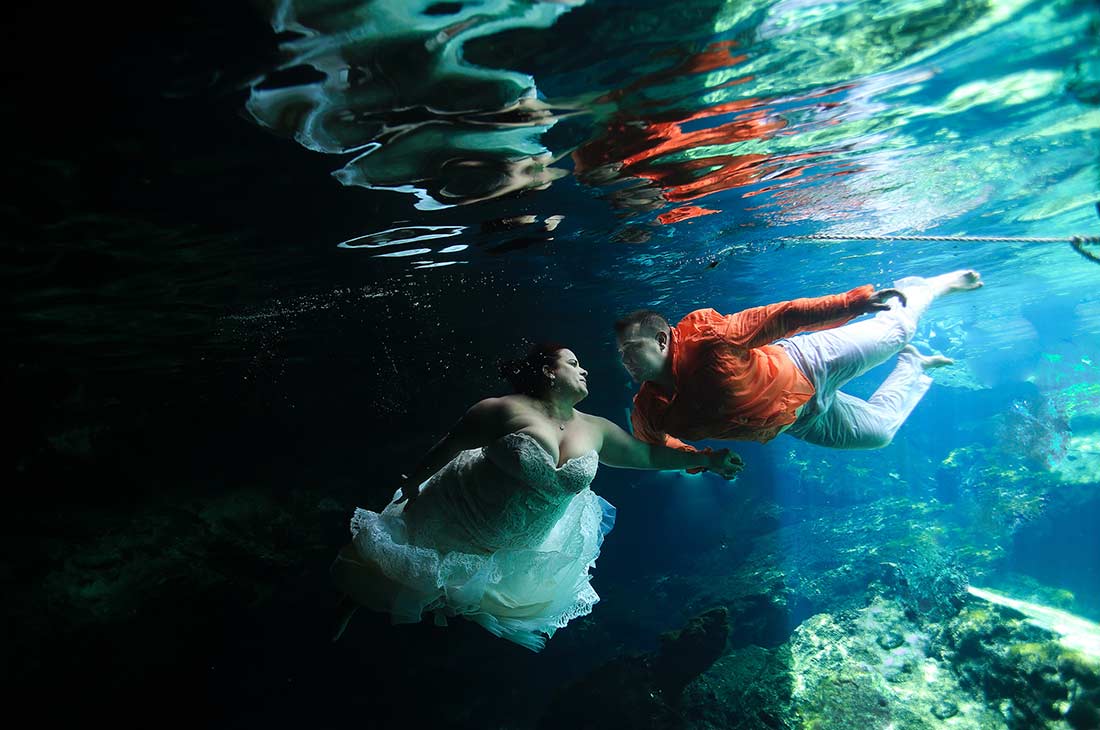 trash the dress in cenotes riviera maya underwater wedding photography